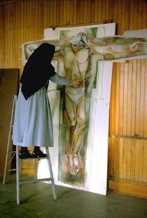 Photo of Sr. Lucia painting her crucifix fresco, 1966