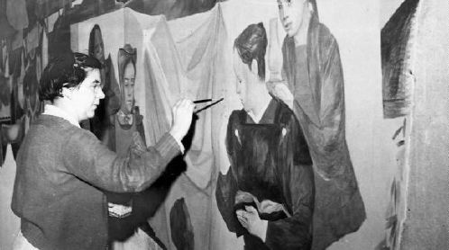 Lucia Wiley working on her mural, 1950